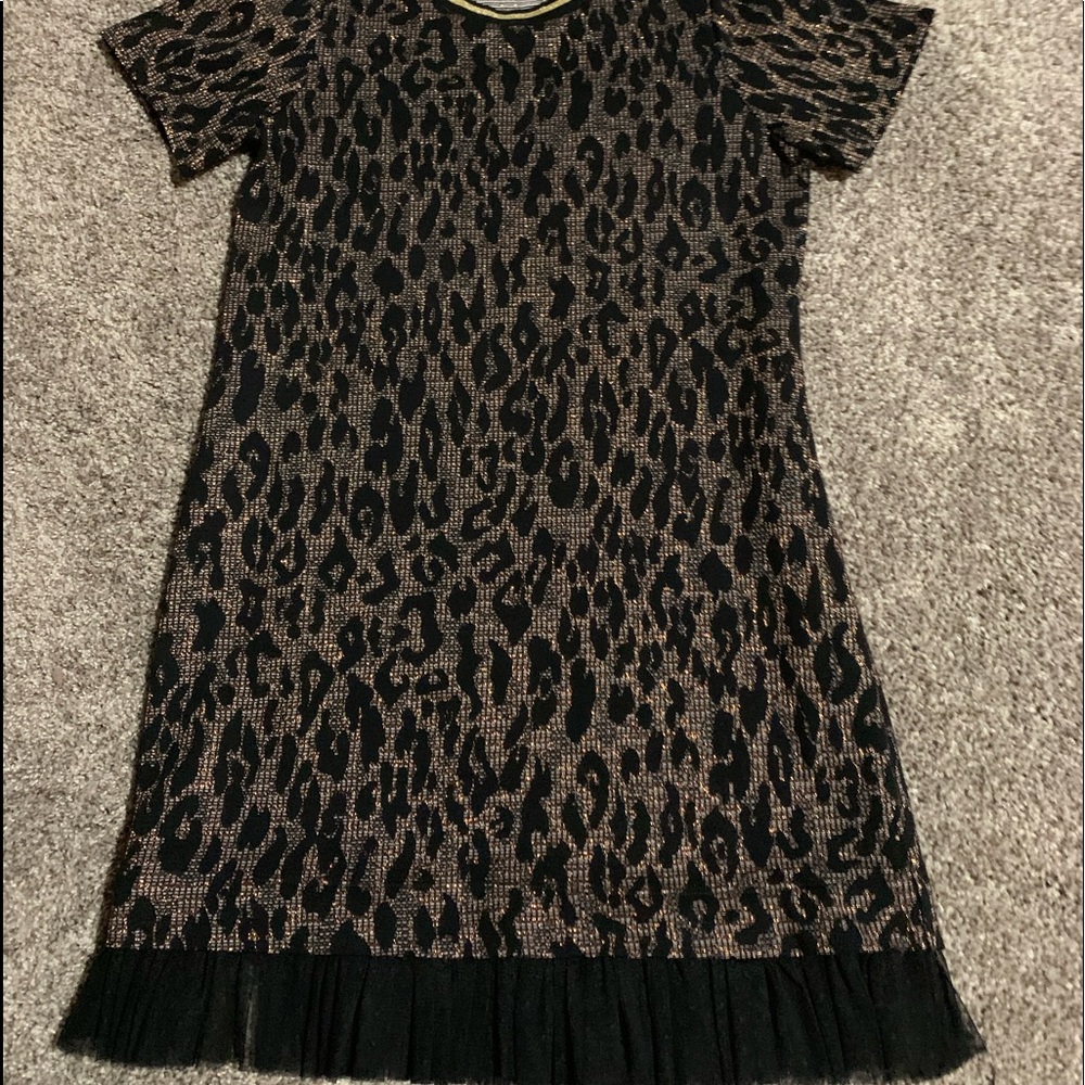 Beautiful leopard printed with gold  & thenblack toule along the bottom. Size Xs